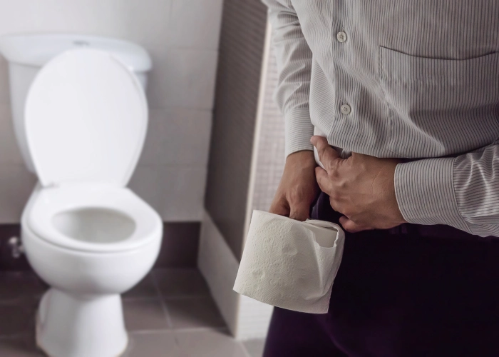 midsection-man-holding-tissue-paper-while-standing-bathroom