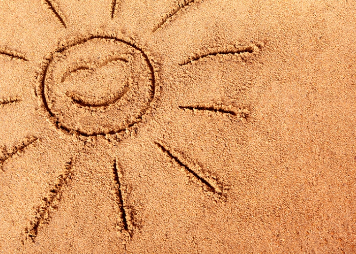 smiling-sun-drawn-sandy-beach202405